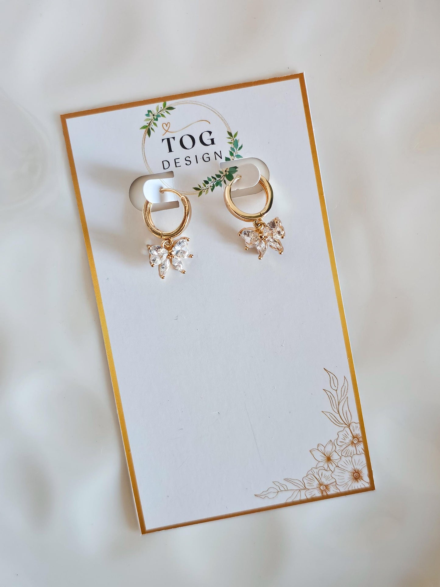 Isabelle | Crystal Bow Huggie Earrings