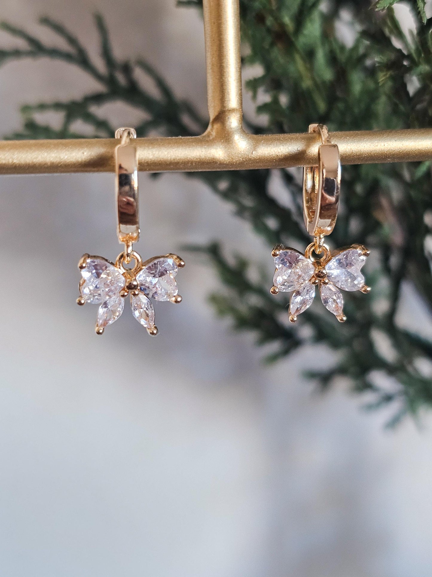 Isabelle | Crystal Bow Huggie Earrings